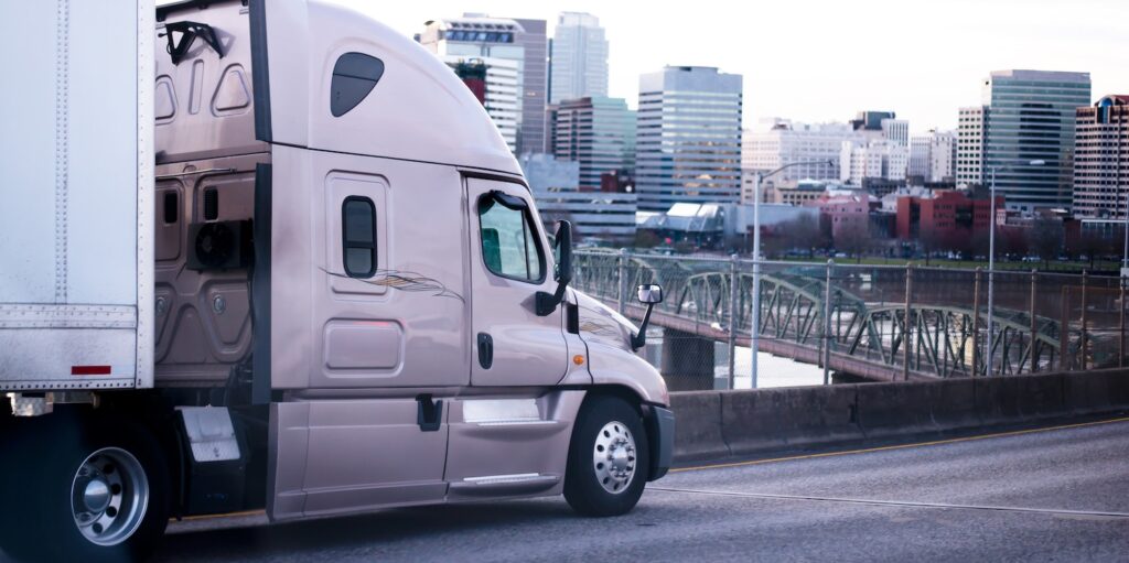 A semi-truck entering a city for urban trucking
