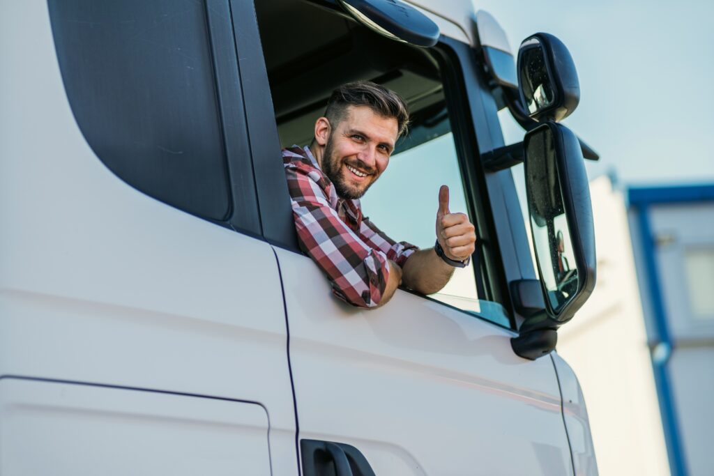 a driving school student giving a thumbs up