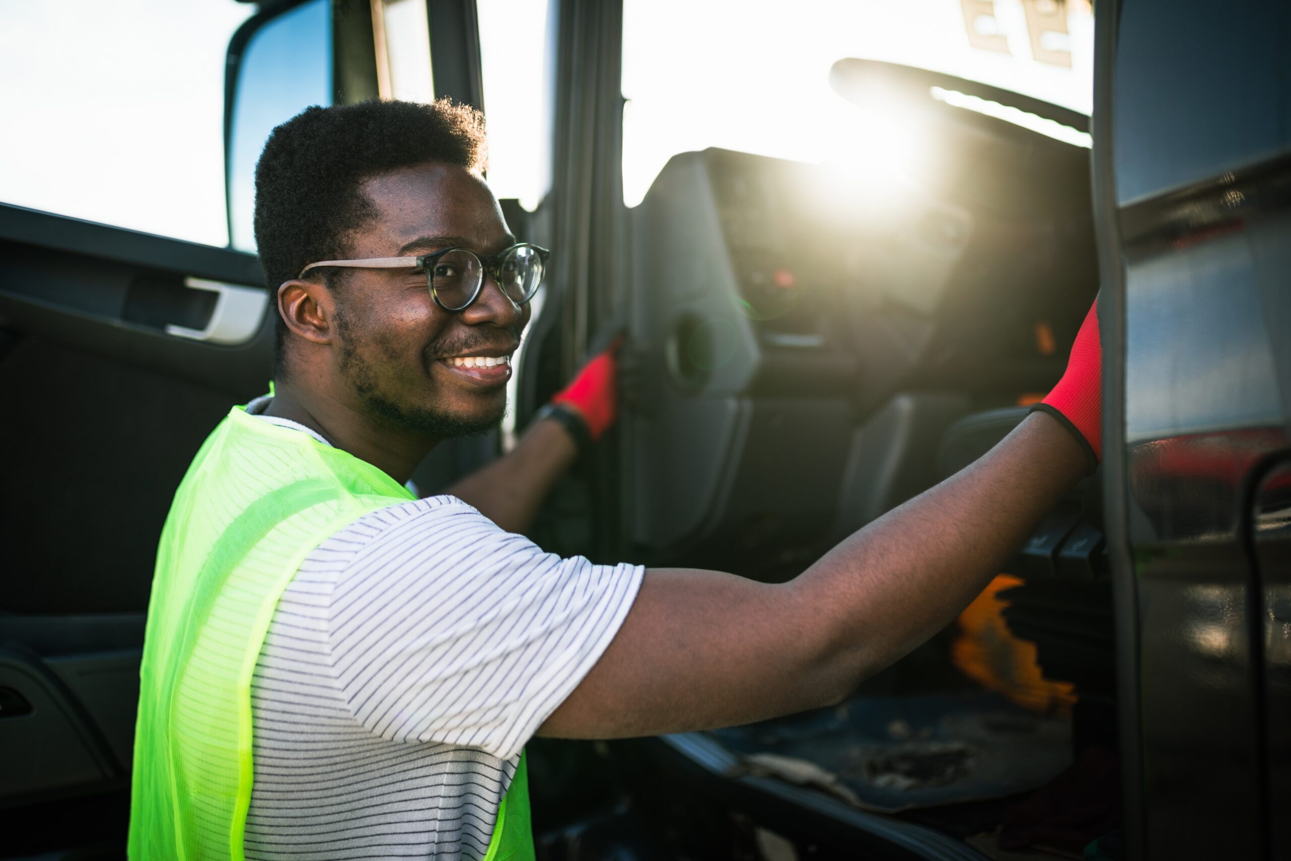 truck driver getting into a truck
